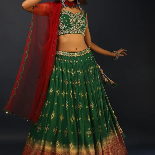 Bottle Green Lehenga In Silk With Patola Printed Buttis And Woven Maroon Border