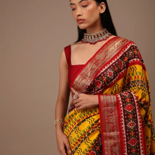 Chrome Yellow Saree In Silk With Multi Colored Patola And Foil Print And Contrasting Maroon Border